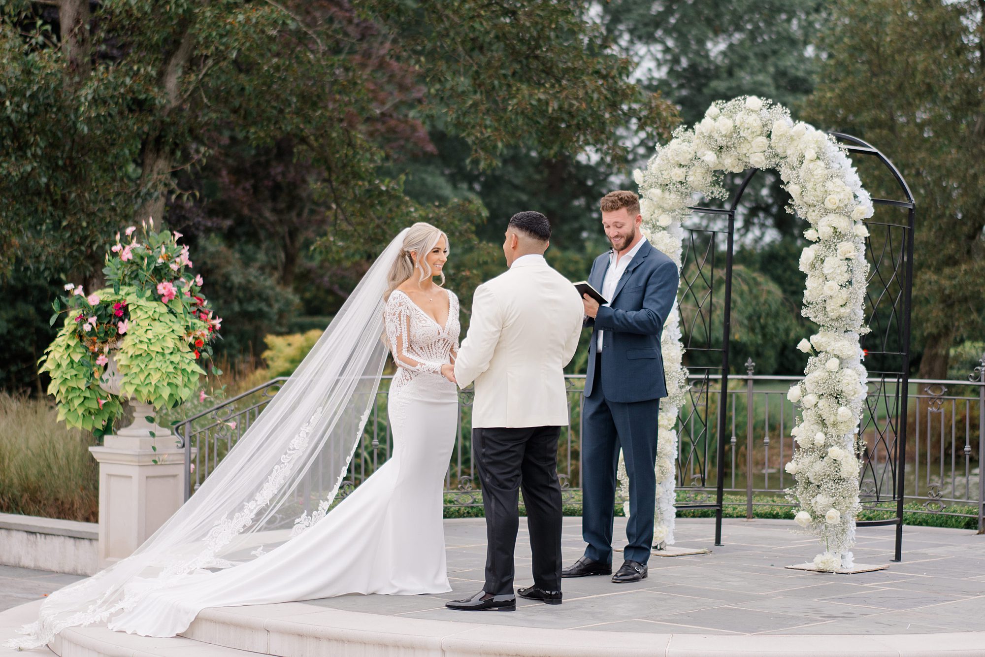 bride and groom tie the knot at Romantic Park Chateau Wedding