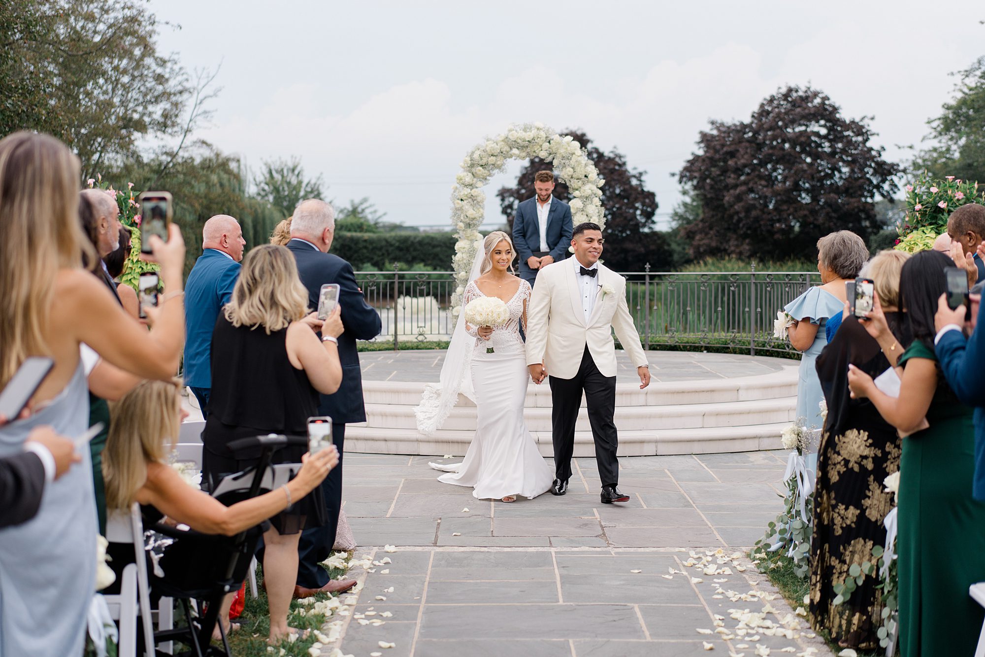 newlyweds exit Romantic Park Chateau Wedding