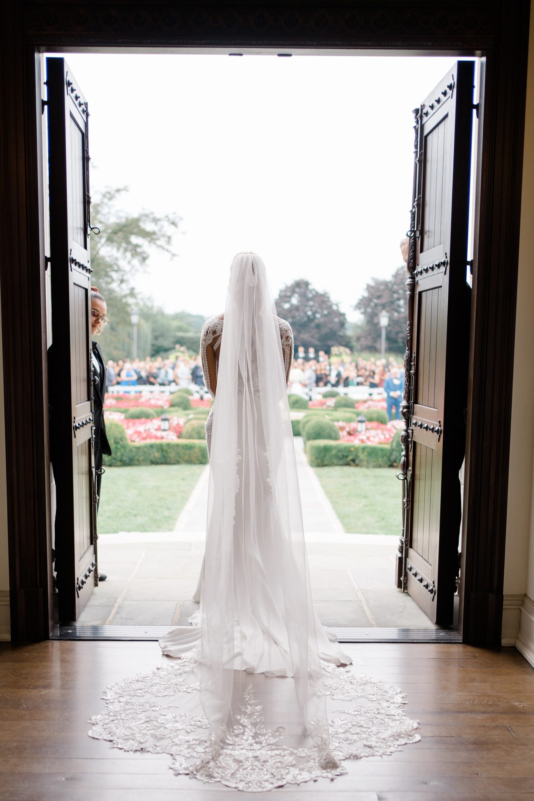 bride walking out of chapel to wedding ceremony