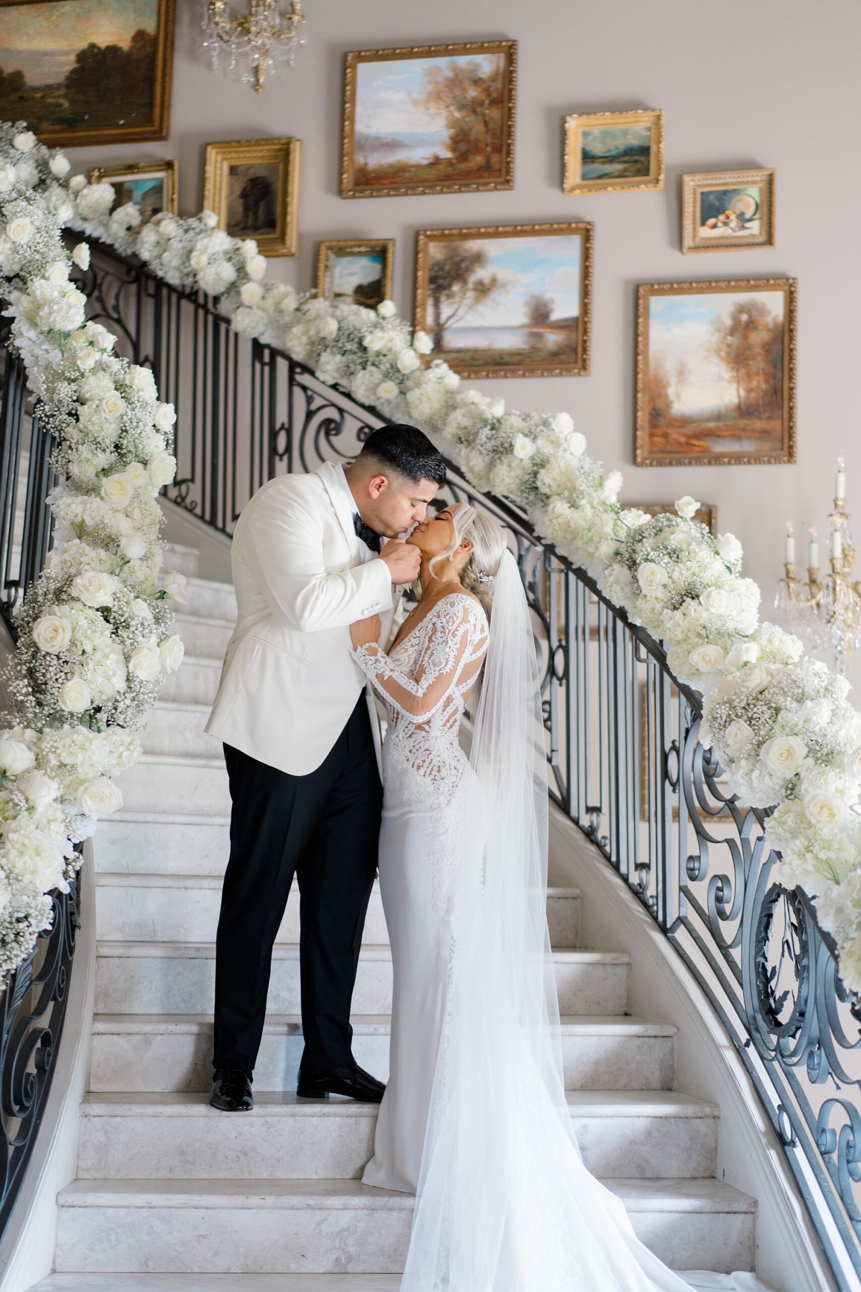 newlyweds kiss on the grand staircase