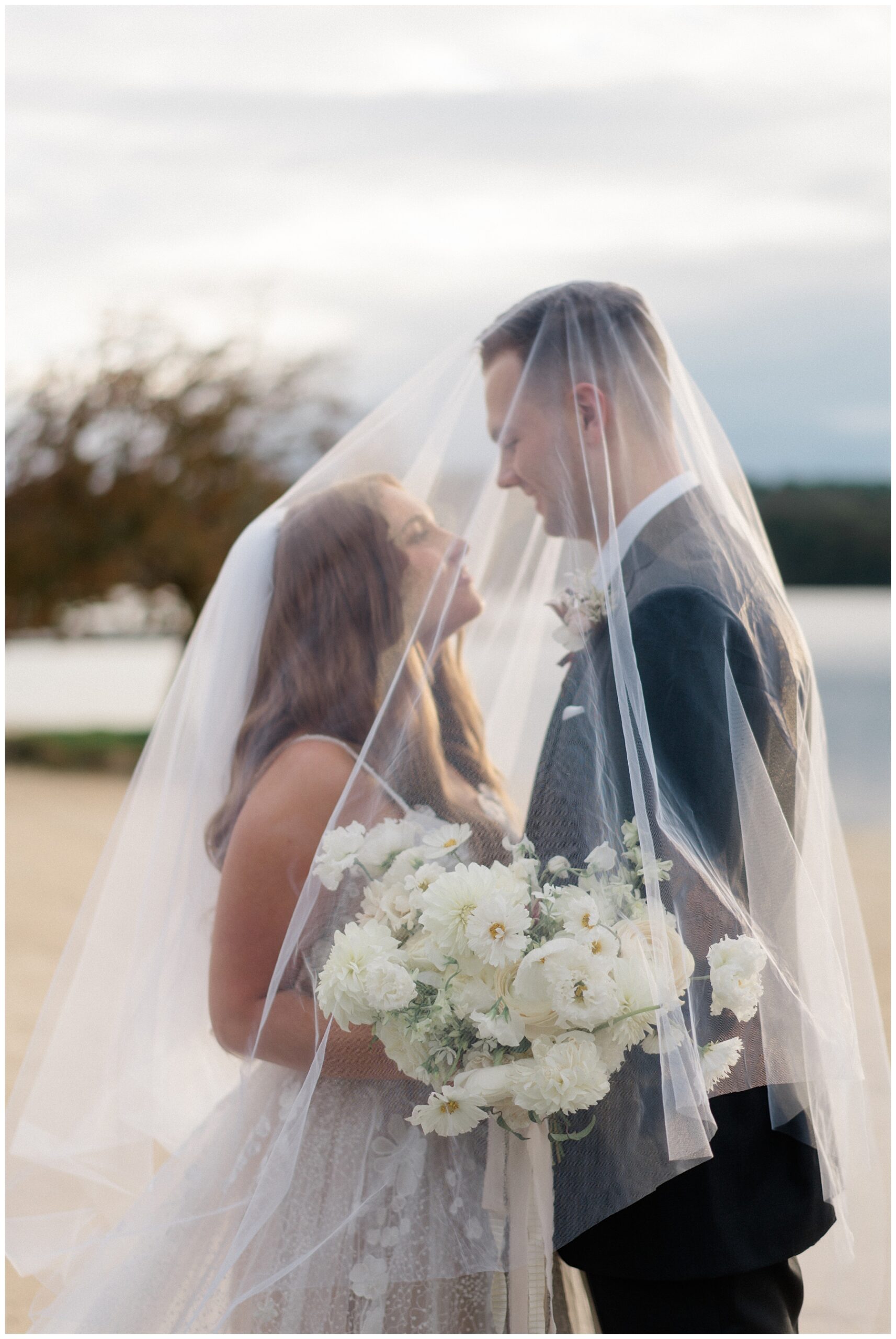 newlyweds under bride's veil 