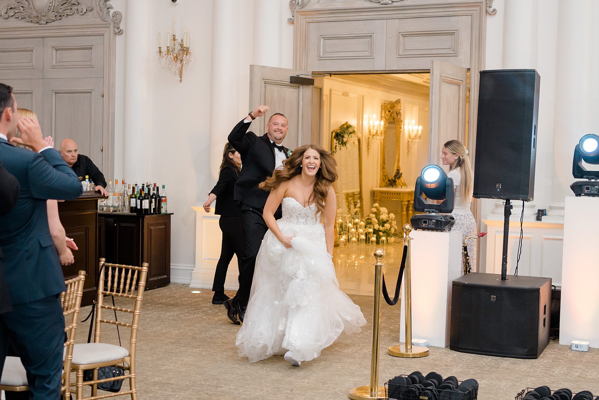couple dance as they enter wedding reception