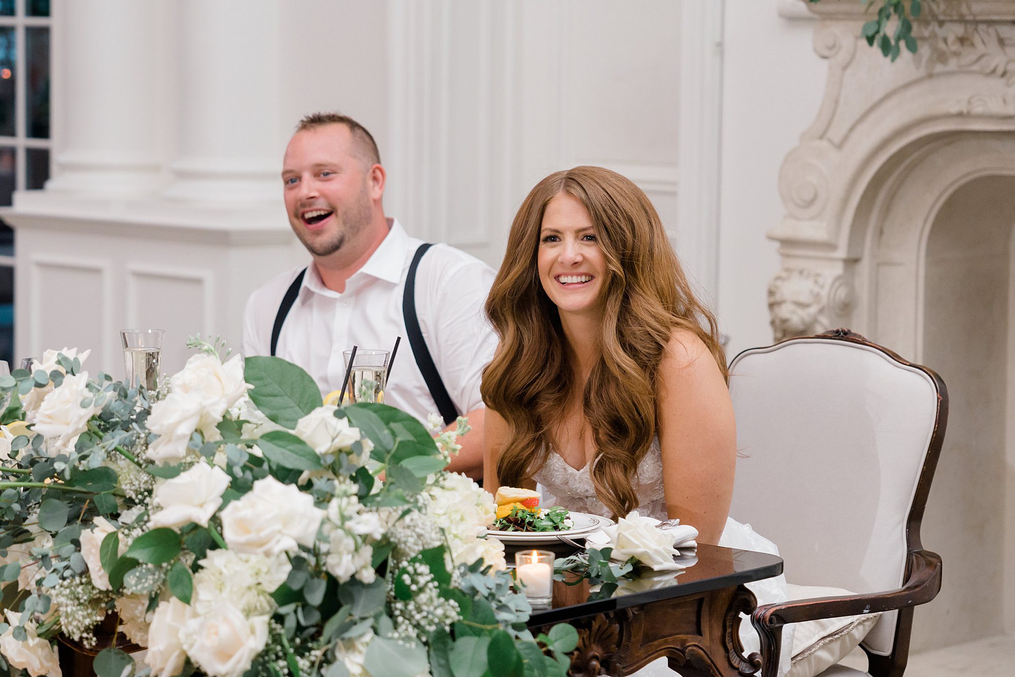 newlyweds laughing at table