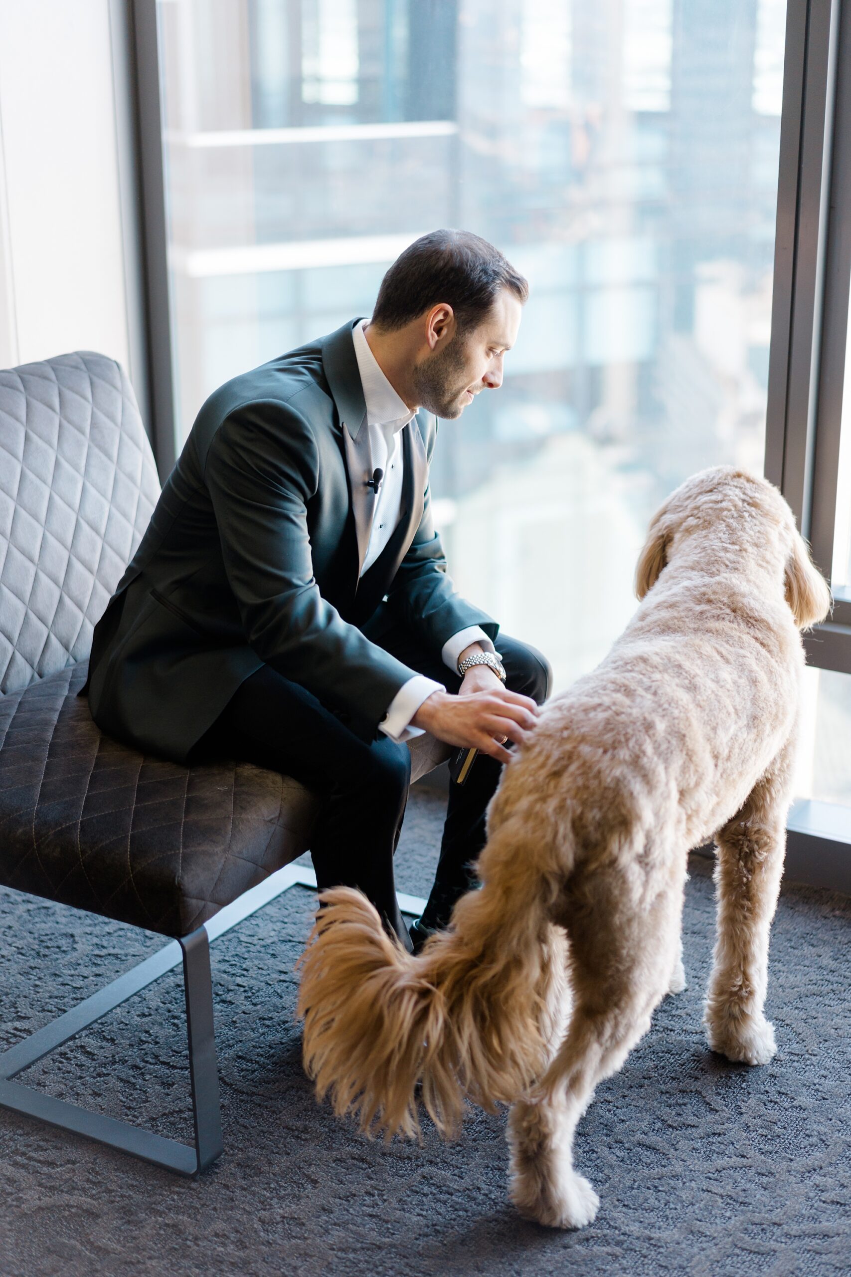 groom with dog before Classic Cescaphe Wedding 