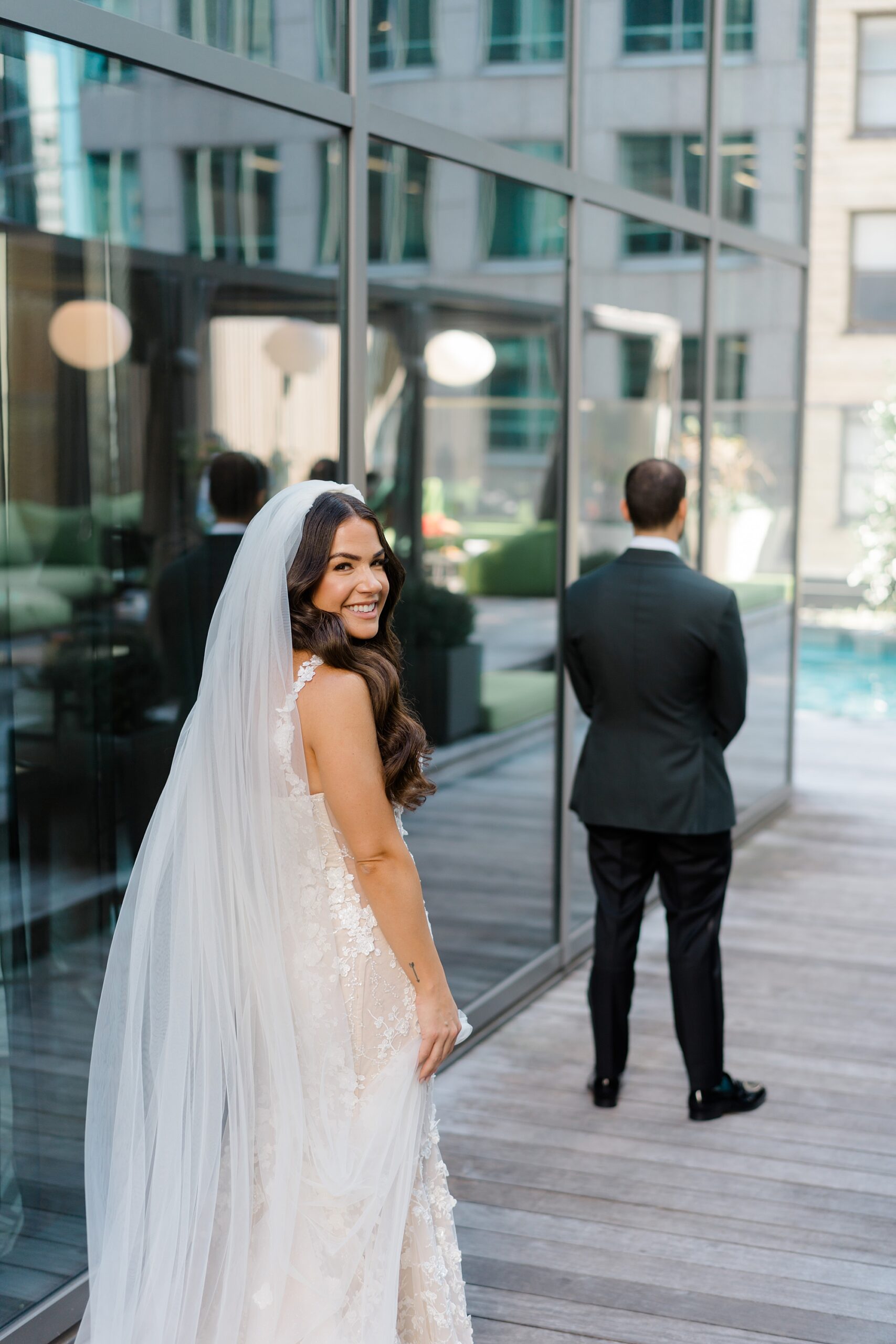 bride behind groom before first look