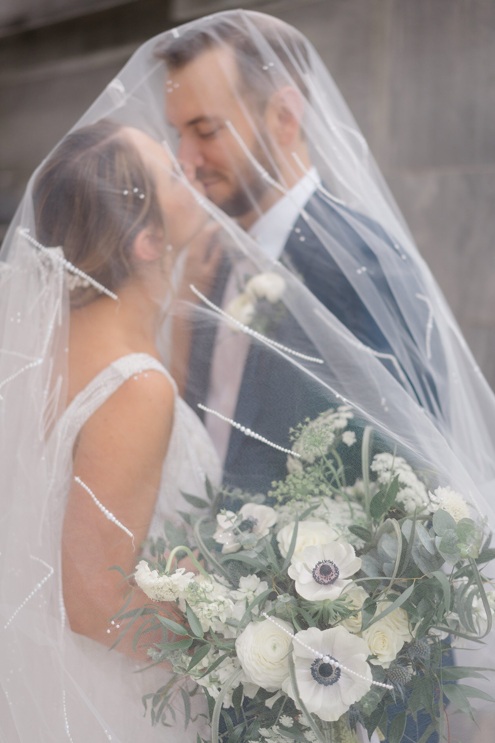 romantic wedding portraits under bride's veil