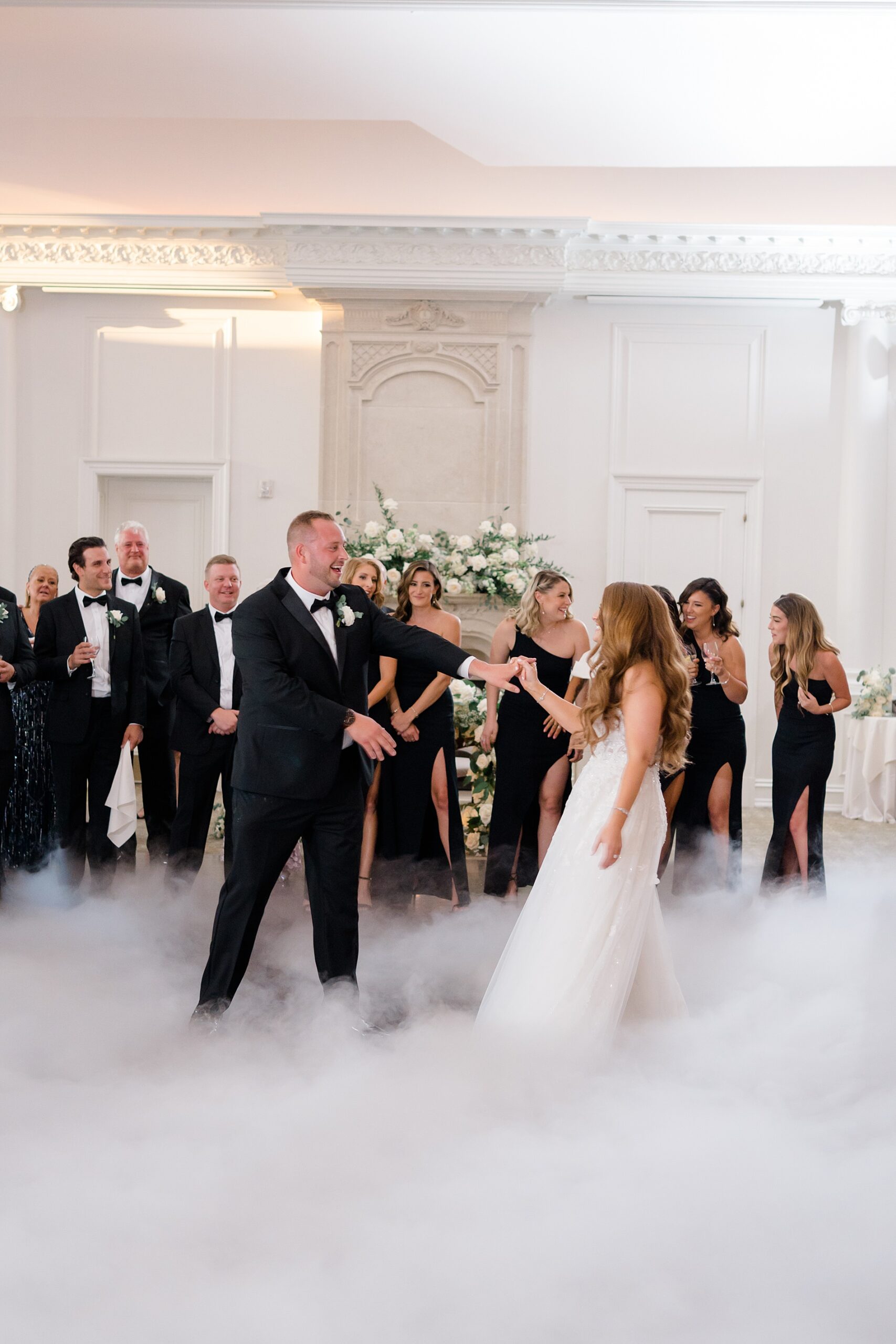 couple on dance floor with fog surrounding them