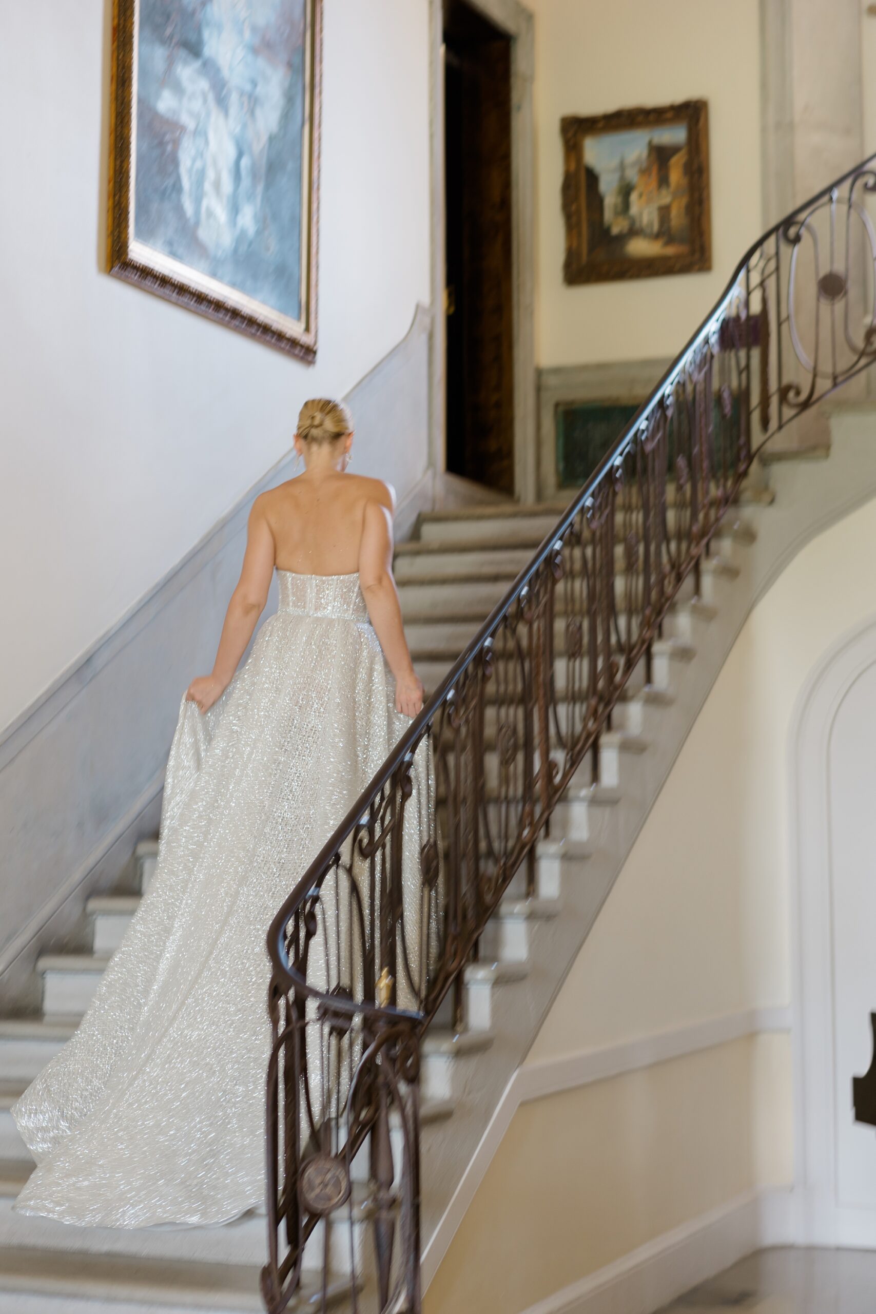 bride walks up grand staircase