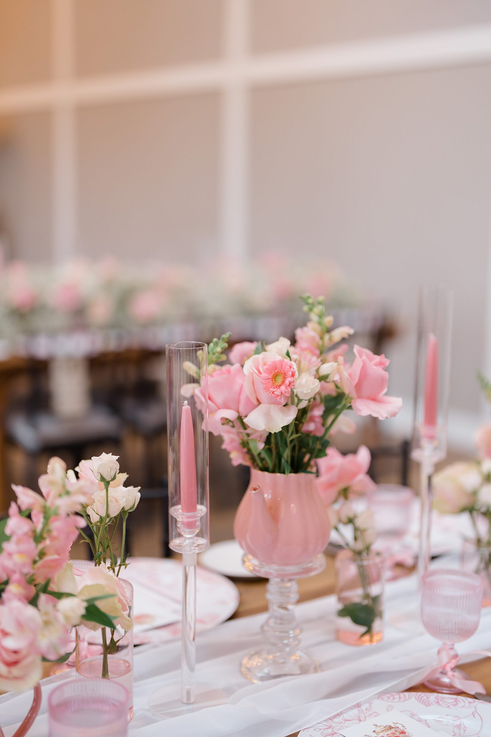 Tea Party Bridal Shower details with pink flowers in teapot vases