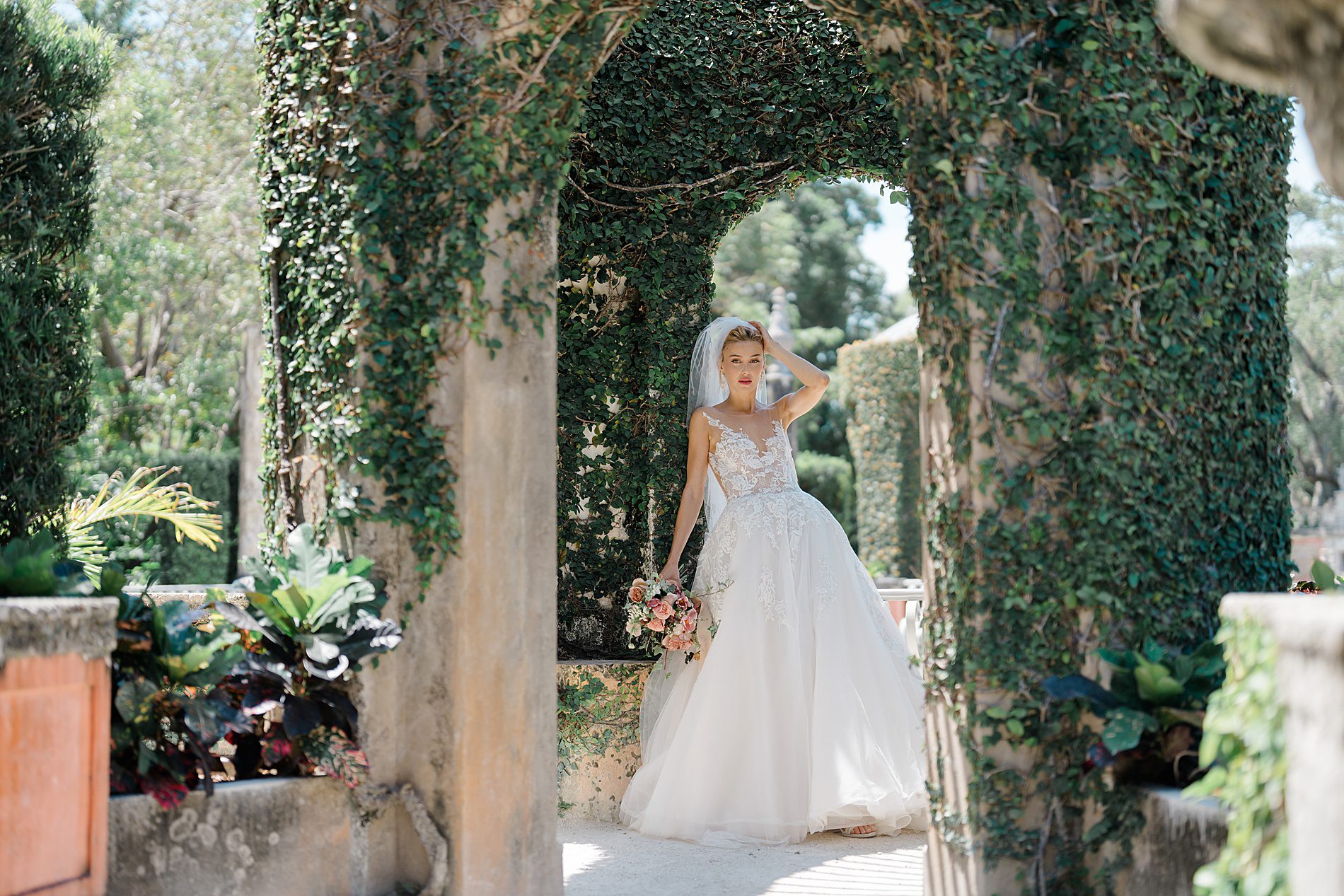 Bride walks through gardens at Vizcaya Museum and Gardens 