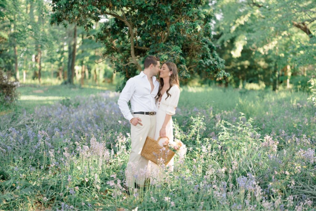 Couple in field of purple flowers during engagement session at Glen Foerd