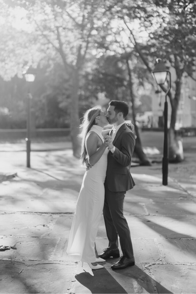 Black and White image of couple slow dancing together during engagement session at Merchants' Exchange