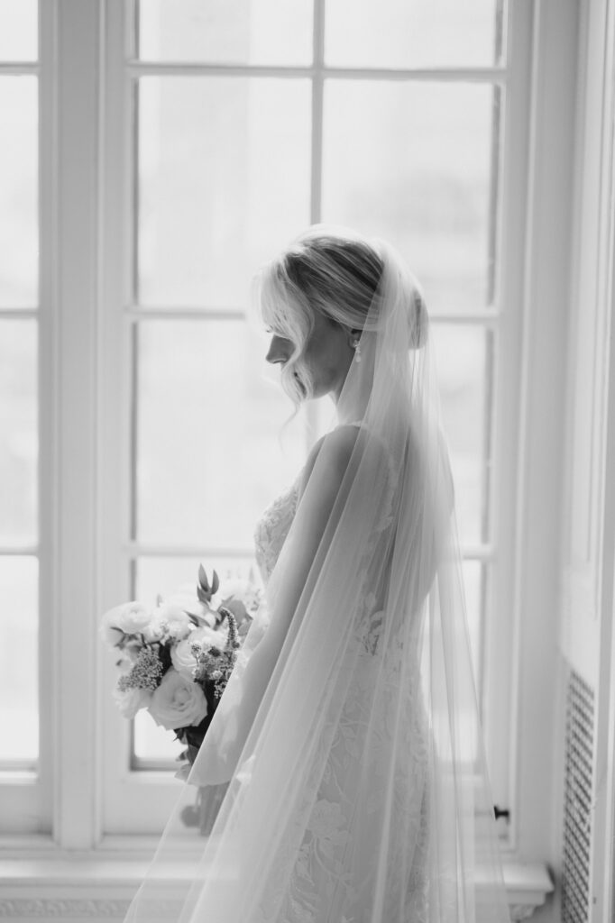 Black and White image of bride in her wedding dress and veil at Curtis Arboretum wedding