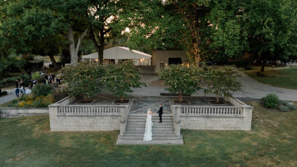 Wide drone image of bride and groom at Curtis Arboretum wedding