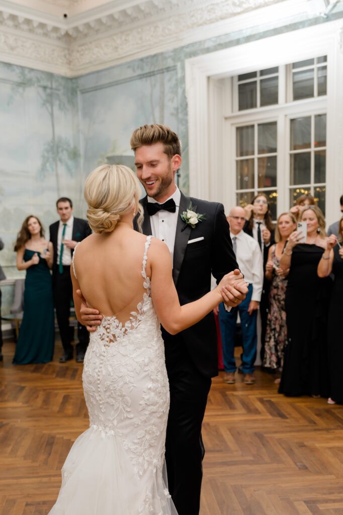 Bride and Groom sharing their first dance during wedding reception at Curtis Arboretum