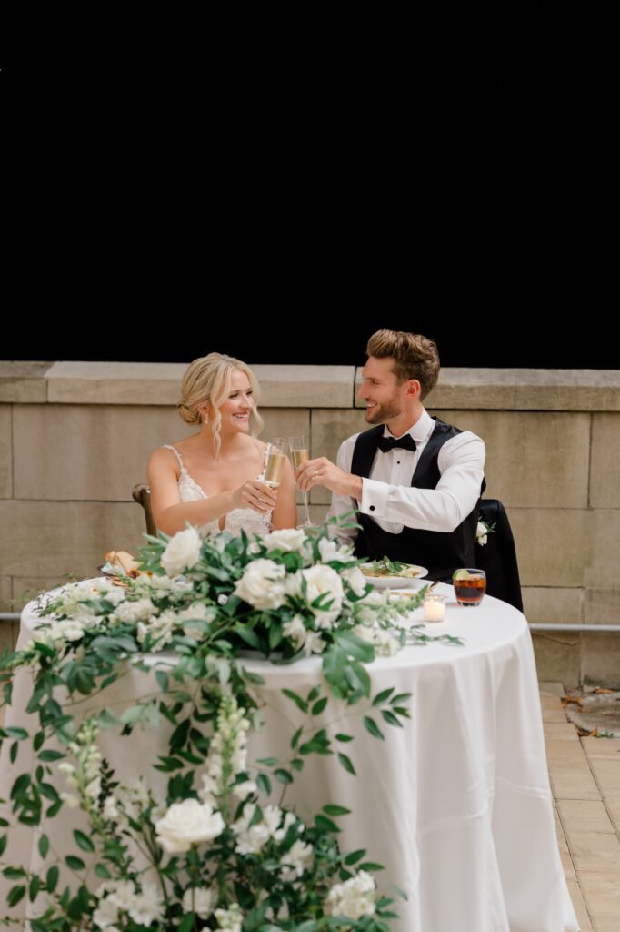 Bride and Groom share a toast during wedding reception at Curtis Arboretum