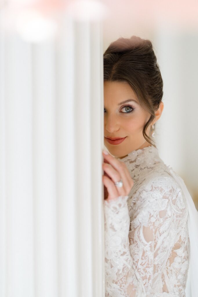 Bride posing along the wall at Crystal Plaza