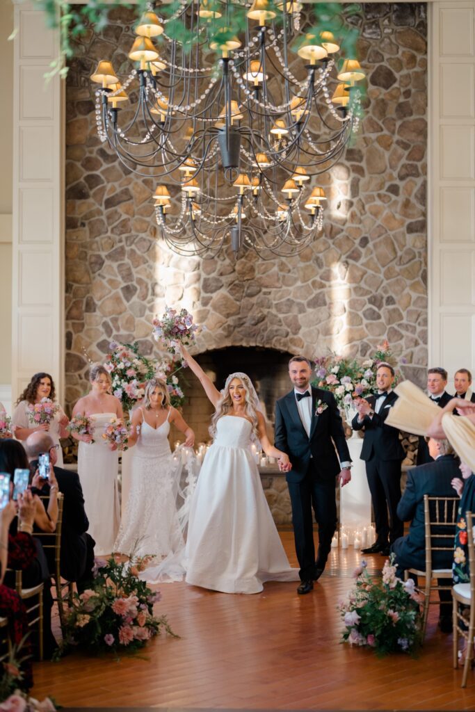 Bride and Groom face their guests after being announced during wedding ceremony at Ryland Inn