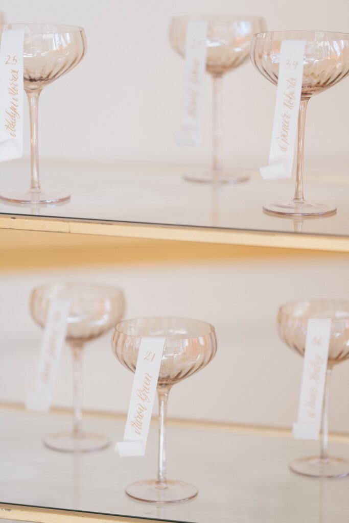 Champagne flutes with table numbers on them at Styled Shoots Across America shoot at Crystal Plaza