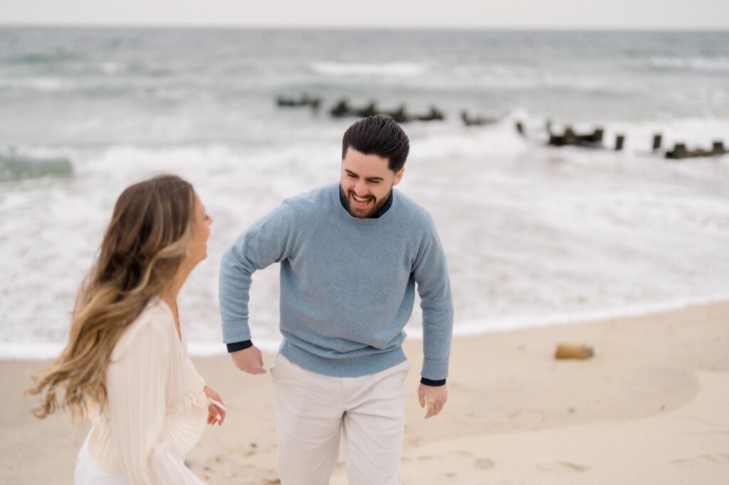 Bride and Groom laughing together on the beach at Spring Lake Engagement